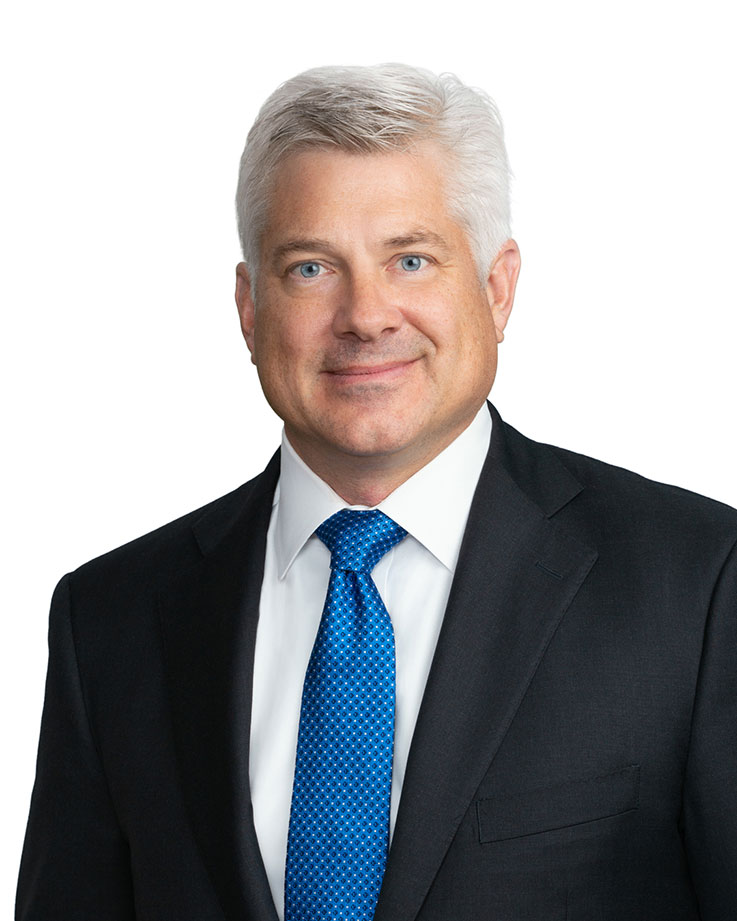 James Cole professional head-and-shoulders portrait on a white background