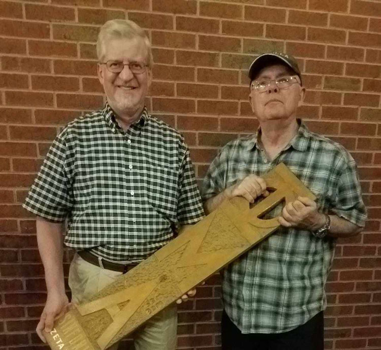 Cunningham and Casavant recreated the photo, paddle included, in 2023. 