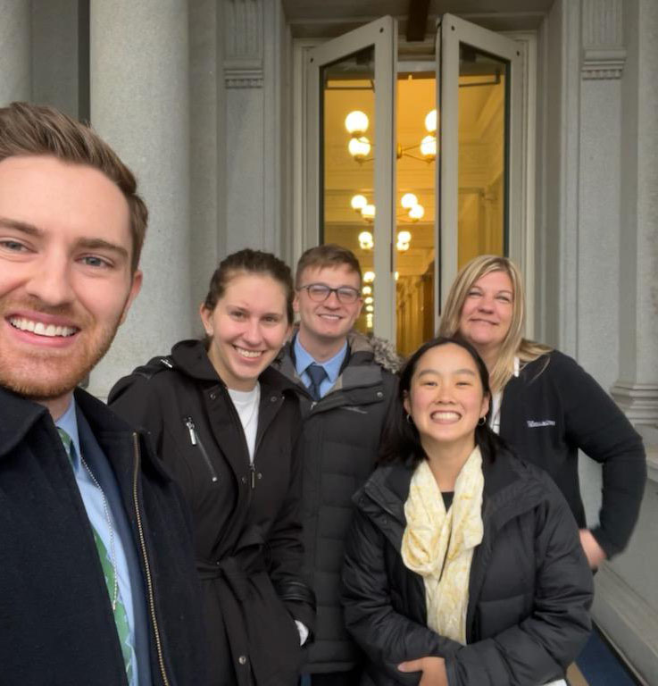 A group photo of Erika and other interns