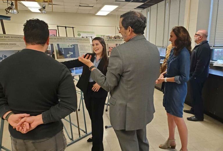 Students presenting their research in the art studio in Sprowls Hall