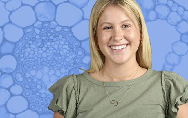 A student being superimposed in front of a blue background.