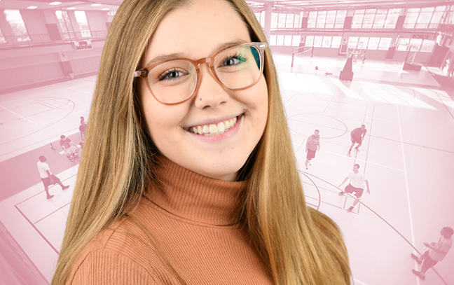 A student being superimposed in front of a pink background showing people playing basketball in a gym.