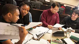 people studying at a table