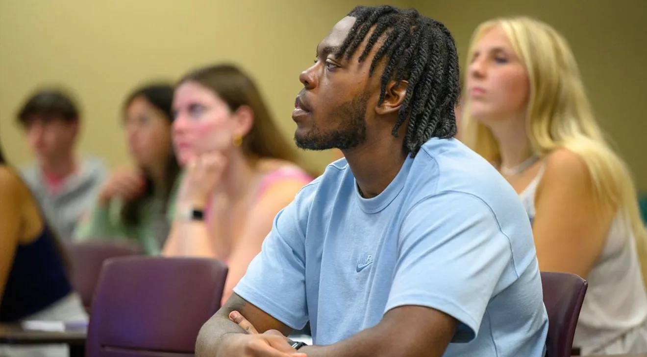 a student sitting in a classroom