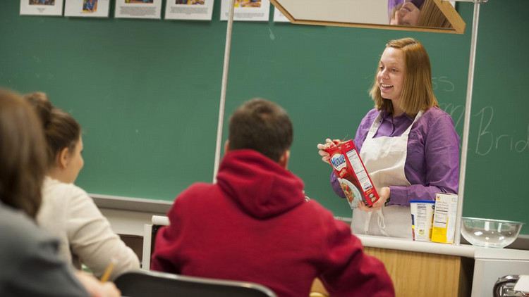 An instructor discussing food options in a family and consumer sciencs classroom