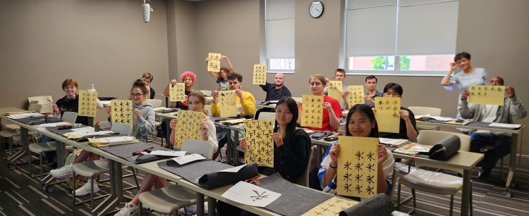 Chinese Program Participants displaying calligraphy practice