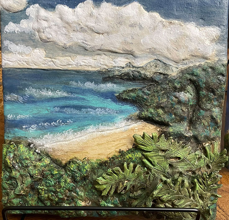 “Nature’s Beauty” by Colleen Myers, showing a sculpted beach landscape including water, sand, and plants.