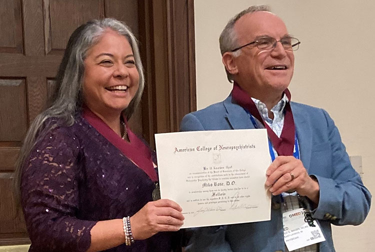 Miko Rose, founding dean of IUP’s proposed college of osteopathic medicine, receives her Fellows recognition from Jed Magen, chair of the Department of Psychiatry at Michigan State University College of Human Medicine.