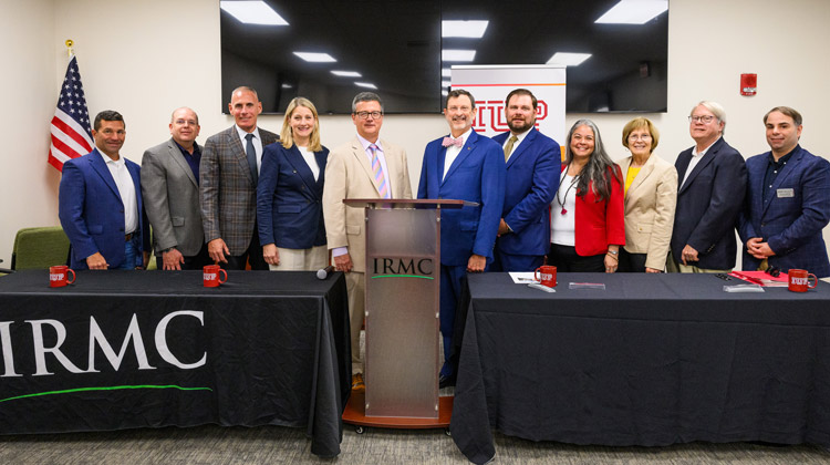 members of IUP and IRMC stand together after the signing