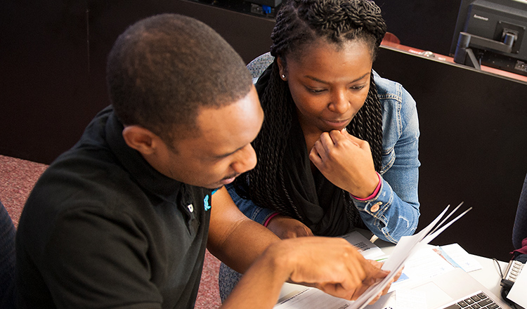 Two students work together on an assignment