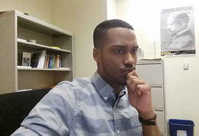 Henry W. Lewis III at his desk